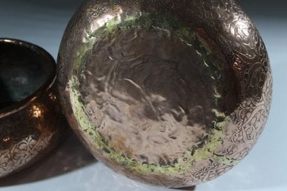 A pair of two circular copper-plated brass...