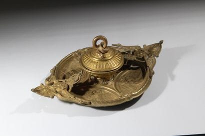 Bronze inkwell 
with rich decoration featuring...