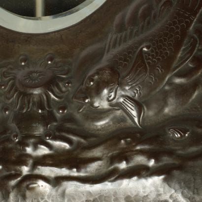 ARTS & CRAFTS 
Beveled mirror with a repoussé...