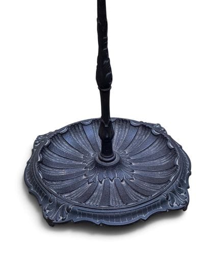 Black-lacquered cast-iron umbrella stand...
