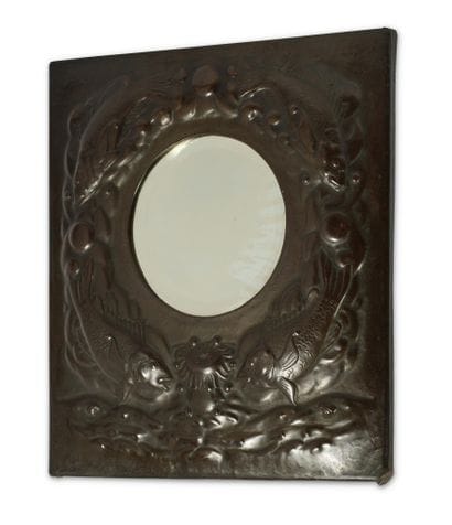 ARTS & CRAFTS 
Beveled mirror with a repoussé...
