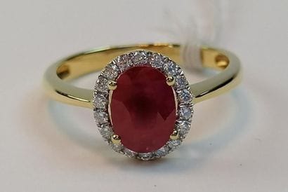 Yellow gold ring set with an oval cut ruby...