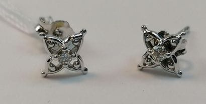 Pair of white gold earrings set with two...