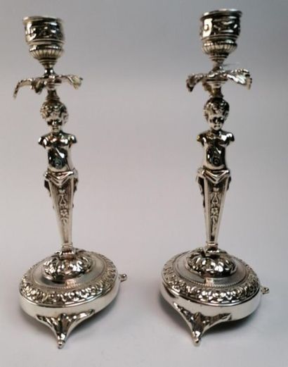 Pair of silvered bronze torches, they rest...