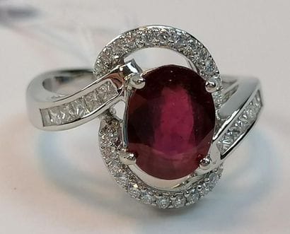 Asymmetrical openwork white gold ring adorned...