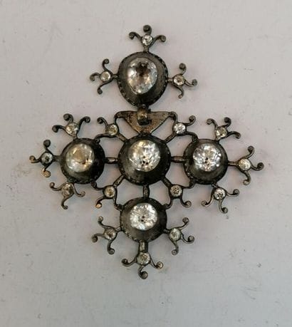 Norman metal cross decorated with rhinestones....