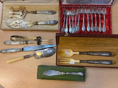 Set includes one silver-gilt sugar tongs,...