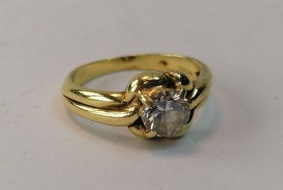 Yellow gold ring set with a modern cut diamond...