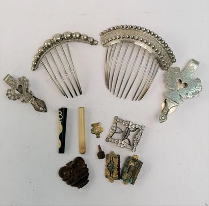 Set includes 2 silver combs (missing teeth),...