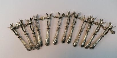 12 ribbed sleeves, silver handles 1st title...