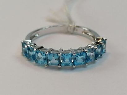Half white gold wedding band set with 9 topazes...