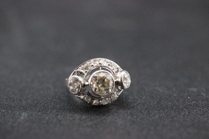 Openwork white gold ring set with a central...