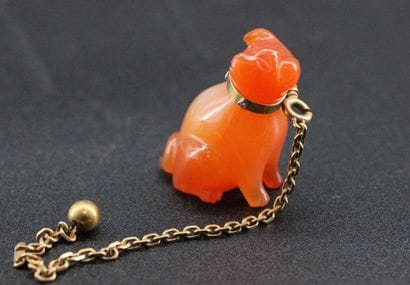 Orange hardstone dog with yellow gold le...