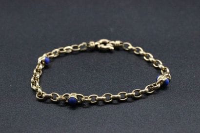 Yellow gold bracelet decorated with lapis...