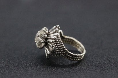 White gold dome ring set with 5 old-cut diamonds....