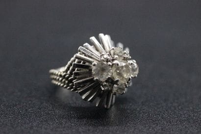 White gold dome ring set with 5 old-cut diamonds....