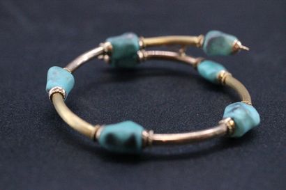 Semi rigid bracelet in yellow gold decorated...