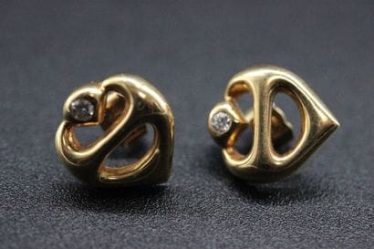 Pair of earrings in yellow gold, model created...