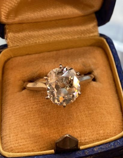 Solitaire cushion cut diamond, platinum setting....