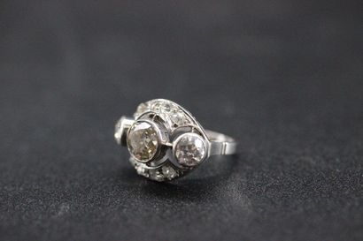 Openwork white gold ring set with a central...
