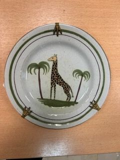 Earthenware plate decorated with a giraffe,...