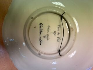 Dish decorated with a vase of life, signed...