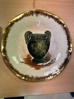 Dish decorated with a vase of life, signed...