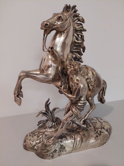 Large silver-plated bronze horse on a base...
