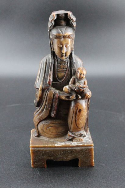 Divinity in hard stone. H 21 cm