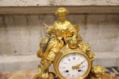 Gilt bronze clock depicting a young woman...