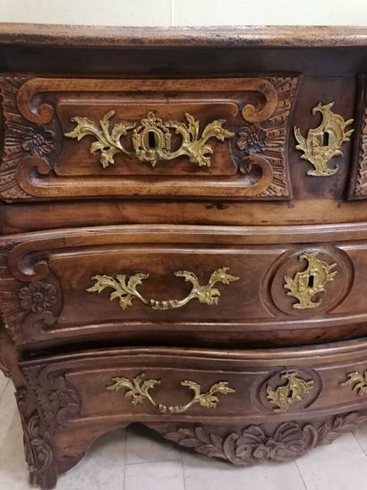 Chest of drawers in natural wood opening...