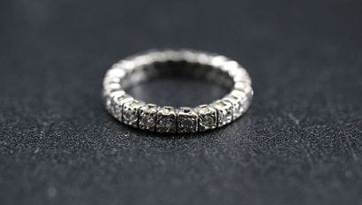 American wedding band in white gold set with...