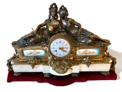 Clock in patinated bronze, decorated with...
