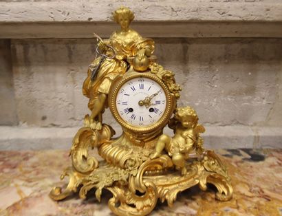 Gilt bronze clock depicting a young woman...