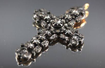 Silver cross, set in yellow gold, adorned...