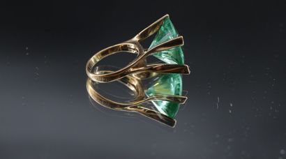 14K yellow gold ring set with a large stylized...