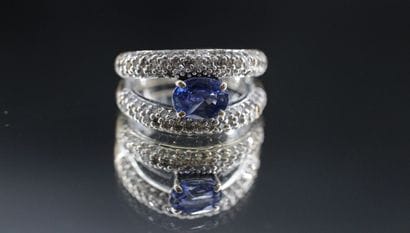 18k white gold ring set with a sapphire and...