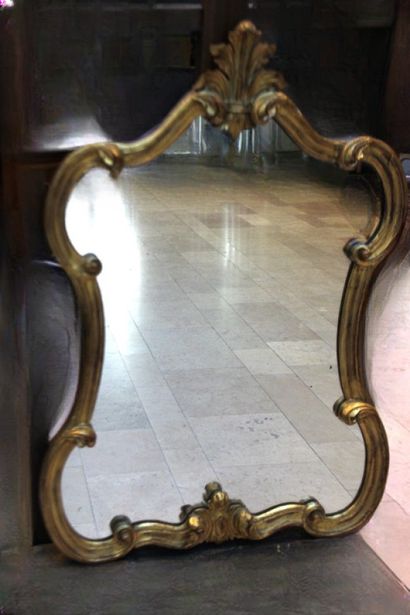 Wood and gilded stucco mirror with scroll...