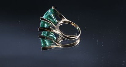 14K yellow gold ring set with a large stylized...
