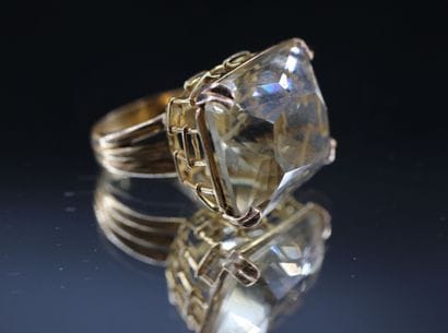 18k yellow gold ring set with a large rectangular...