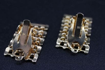 Pair of low-cut yellow gold earrings ???...