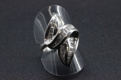 18k white gold modernist ring set with baguette-cut...