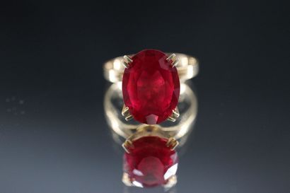 18k yellow gold ring set with a treated ruby....
