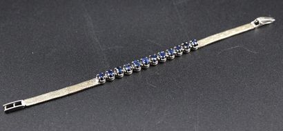 Silver bracelet set with 12 blue stones....