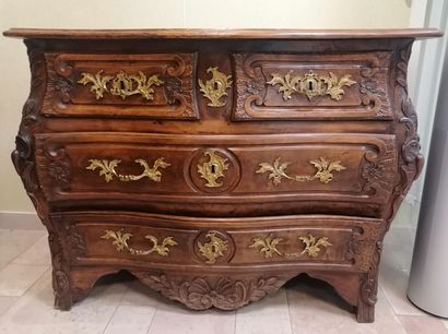 Chest of drawers in natural wood opening...