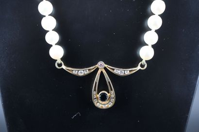 Cultured pearl necklace adorned with an 18k...