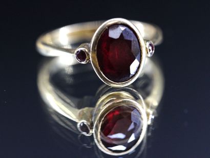 Yellow gold ring set with an 18k red stone....