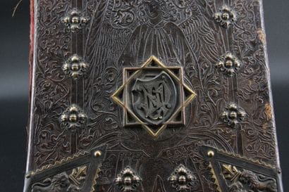 Leather document holder stylizing a cherub...