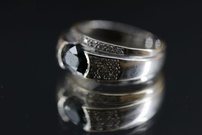 18k white gold ring set with a blue stone...