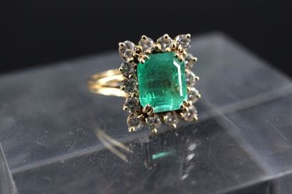 Yellow gold ring set with an emerald-cut...